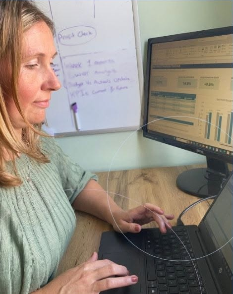 Tessa Rivers at her desk, working through a client's numbers